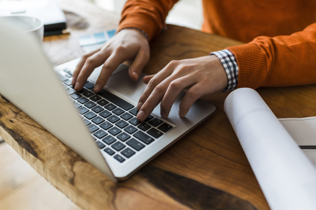 Close up of man using laptop