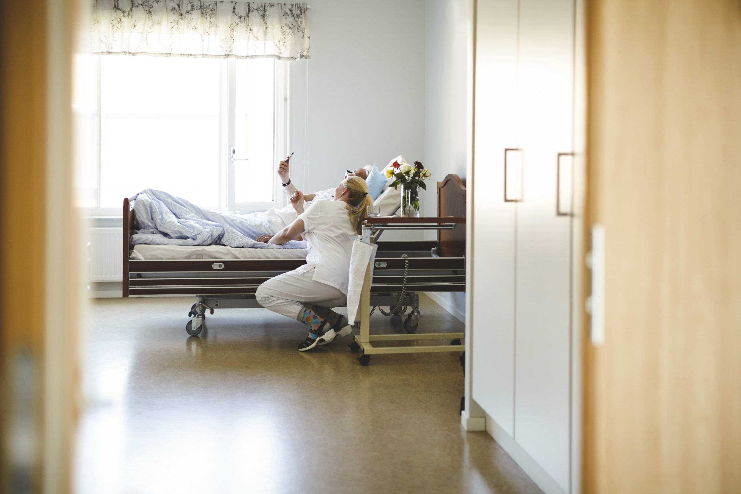 Nurse and patient taking a selfie in the hospital