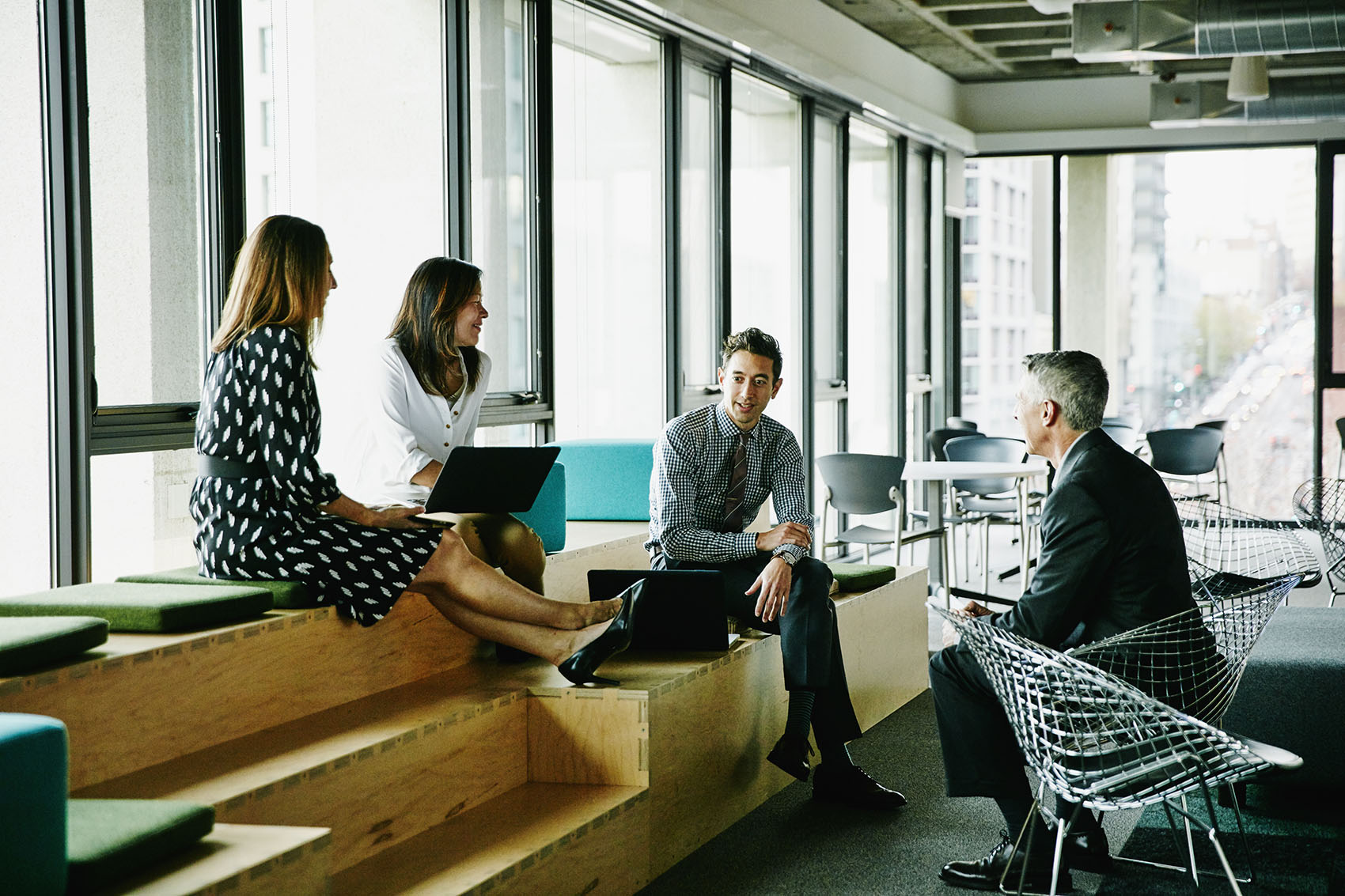 Colleagues having informal meeting in office