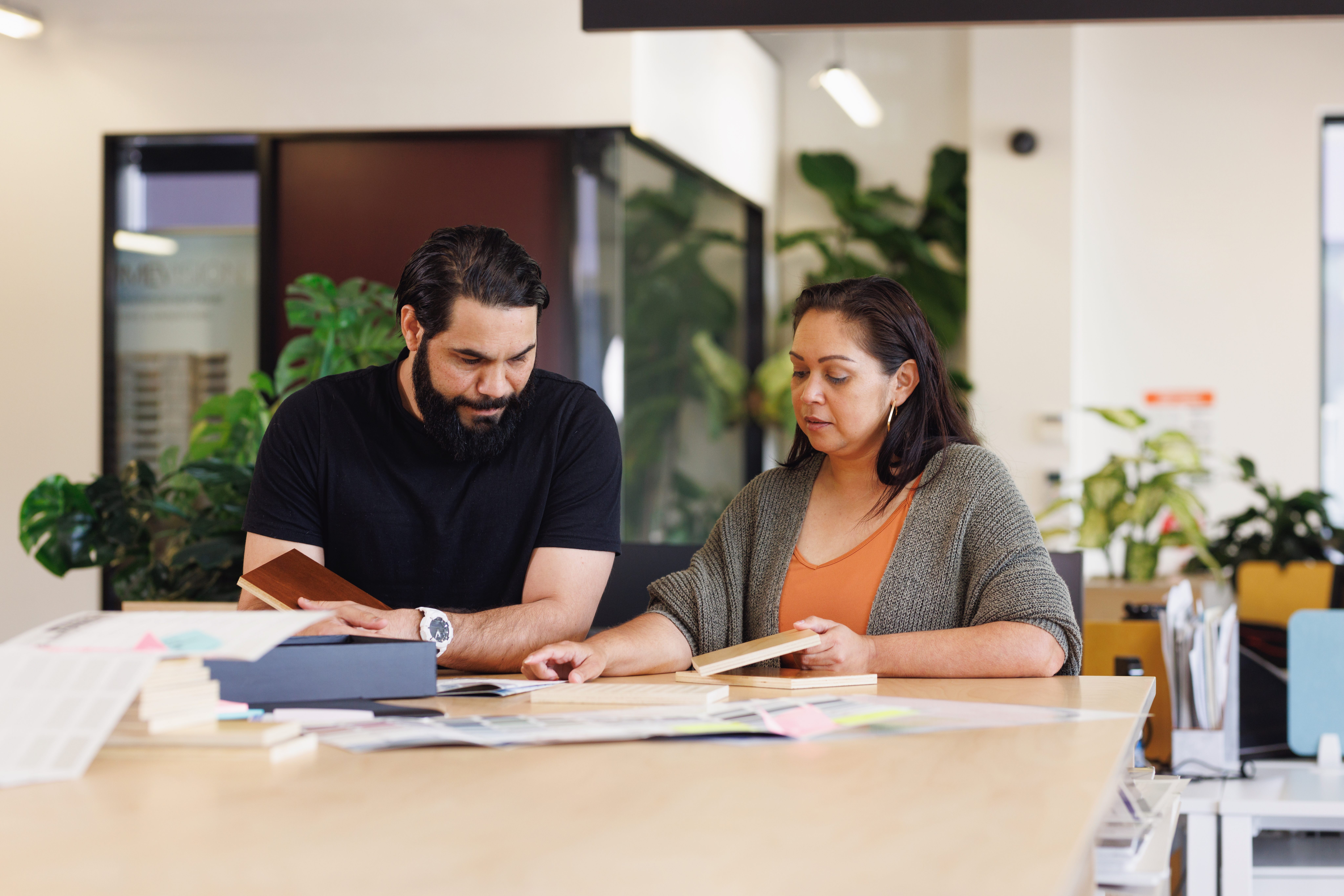 Two colleagues collaborating in office