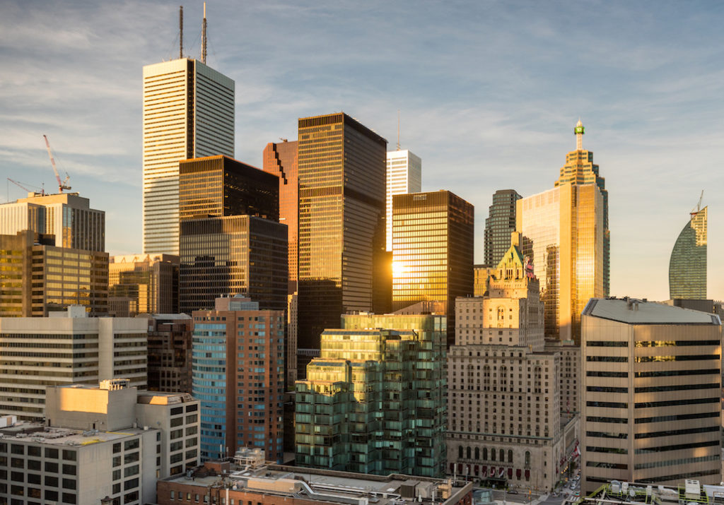 Wide angle view of warm sunlight illuminating the financial district of Toronto, Ontario, Canada.
