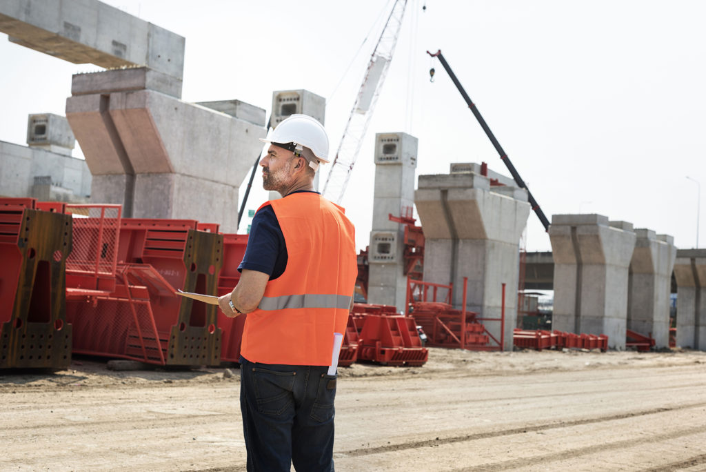 Construction worker overseeing a project