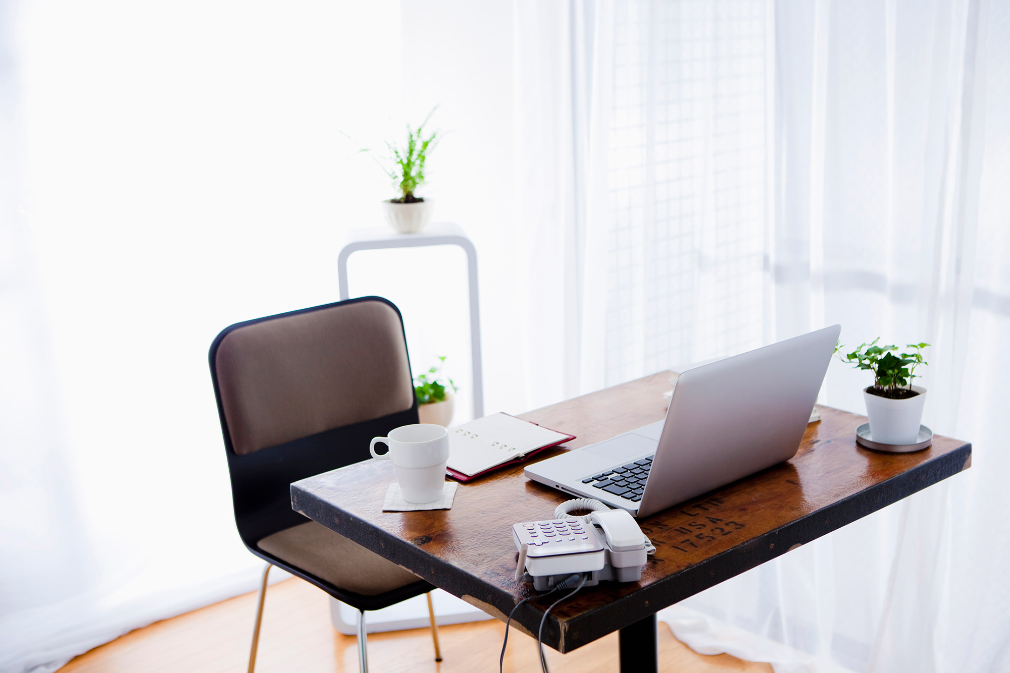 At home office with laptop on desk