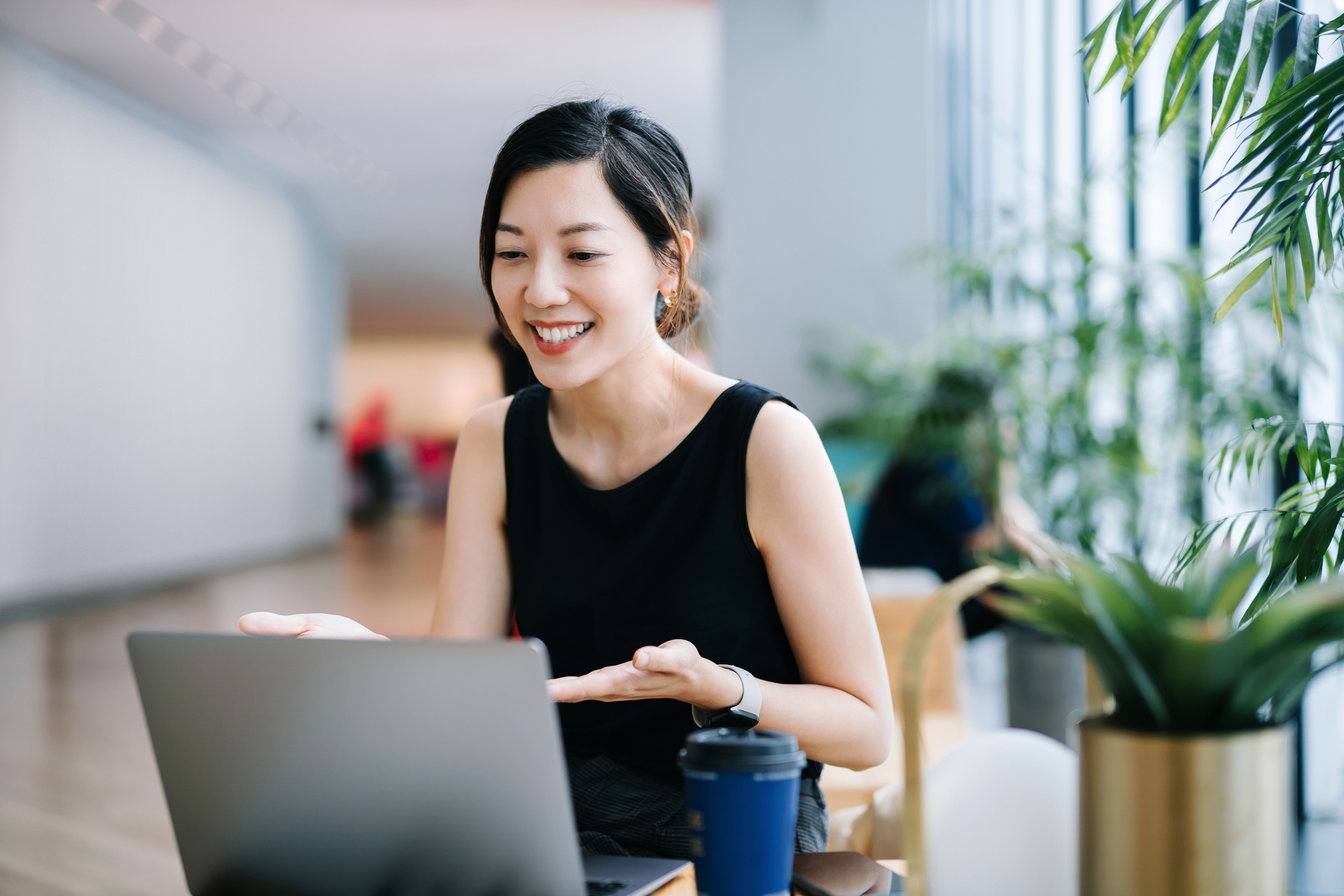 Business woman smiling talking having a virtual job interview