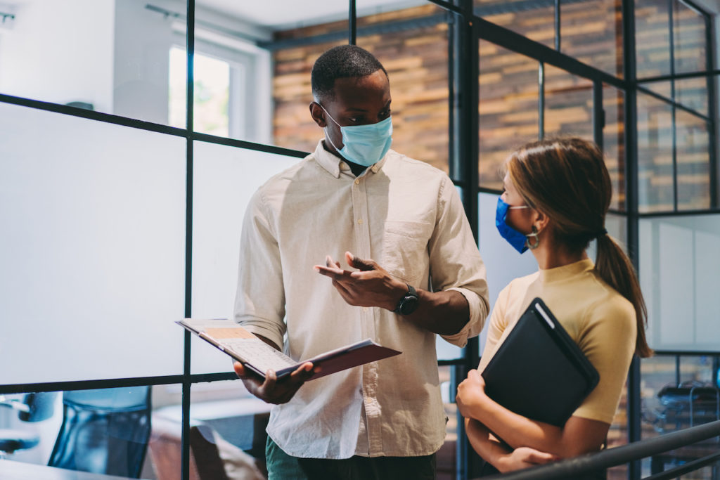 Businesspeople wearing masks in the office 