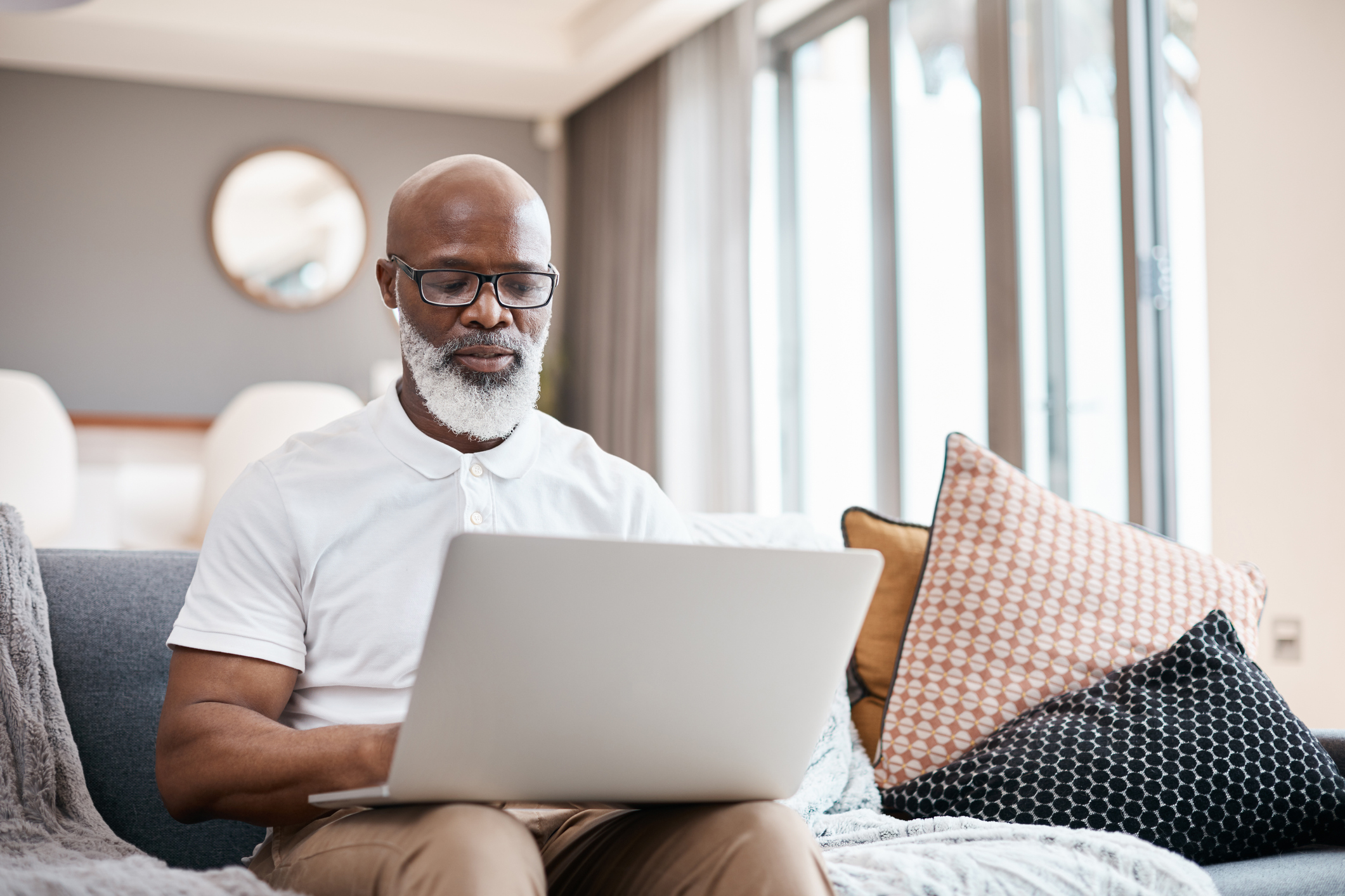 Shot of a man using a laptop at home