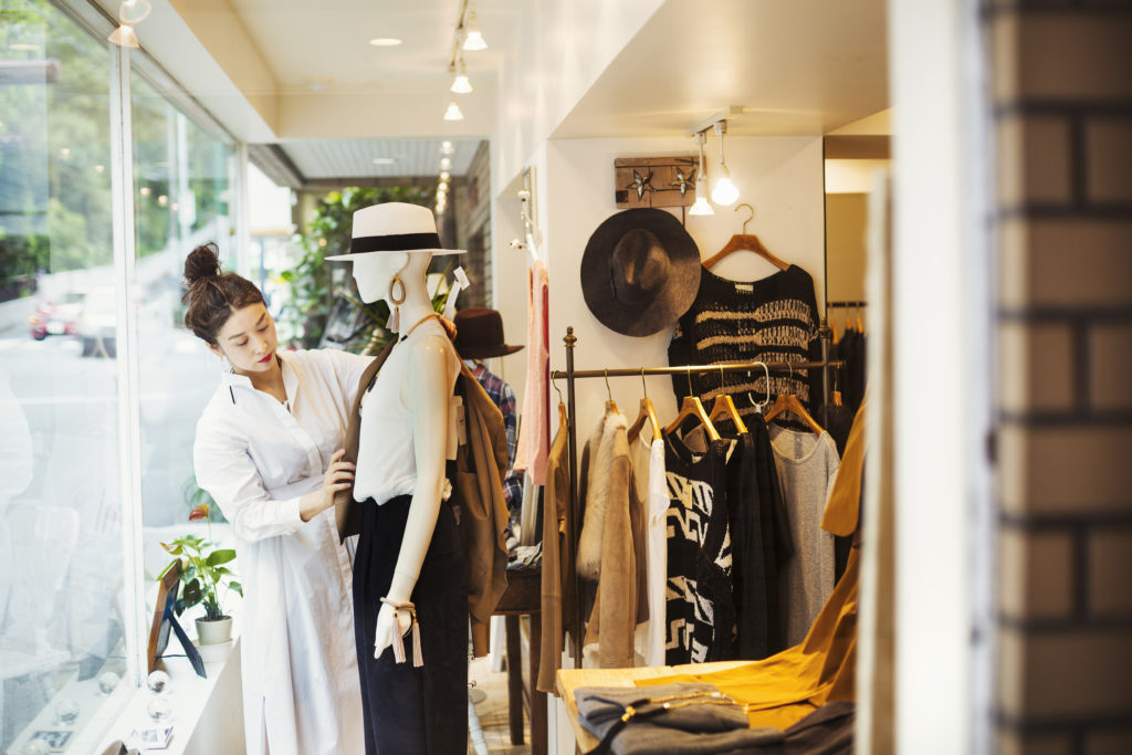 Woman working in a fashion boutique.