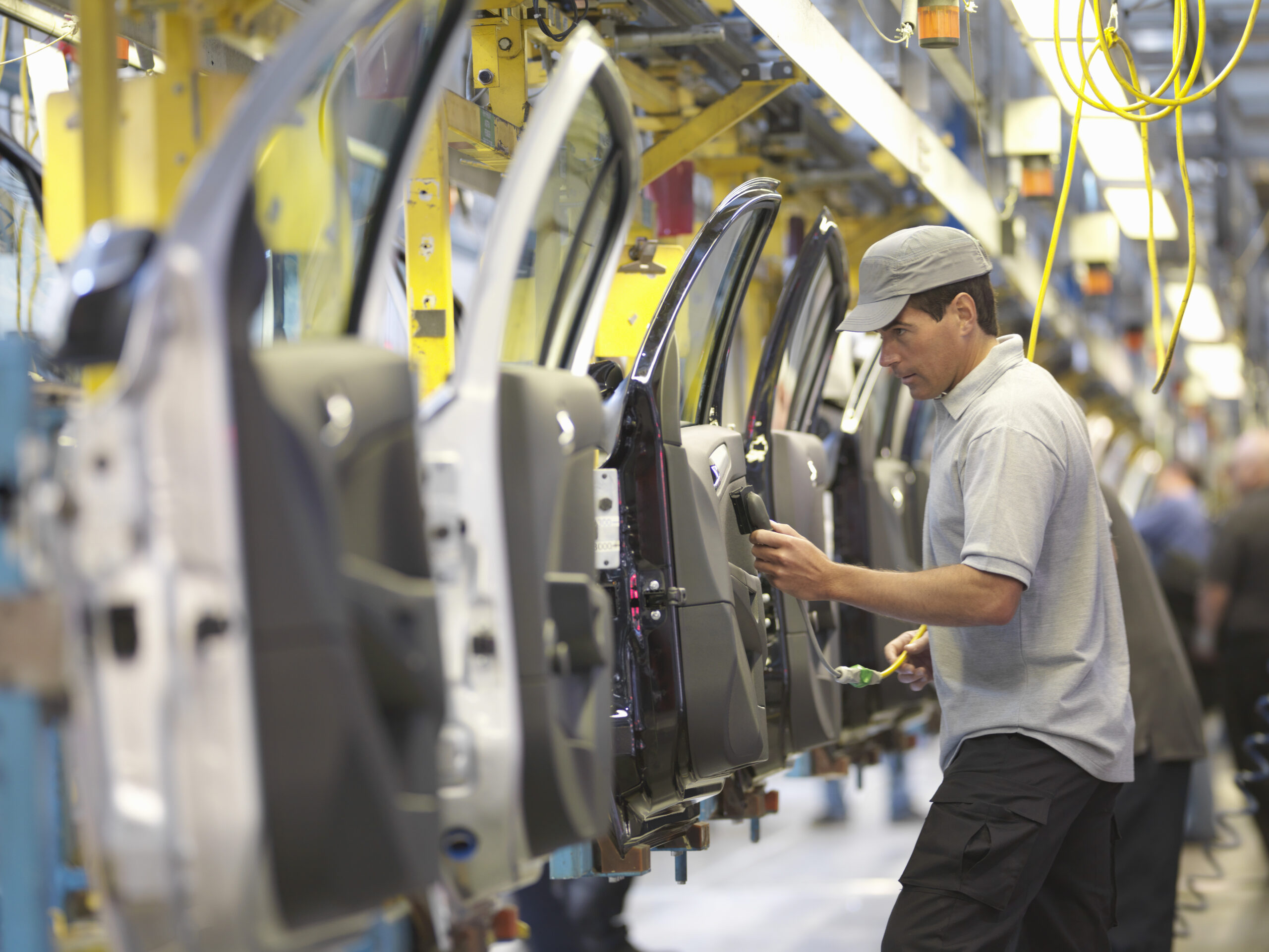 Manufacturing worker on car plant production line