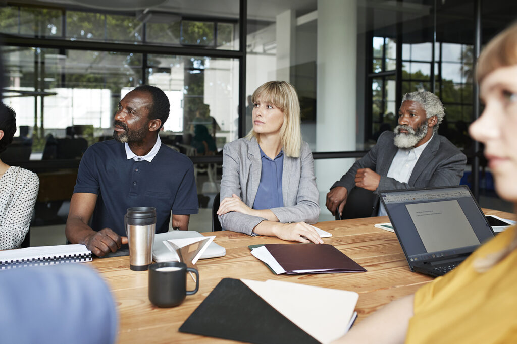 Coworkers at conference table during business meeting