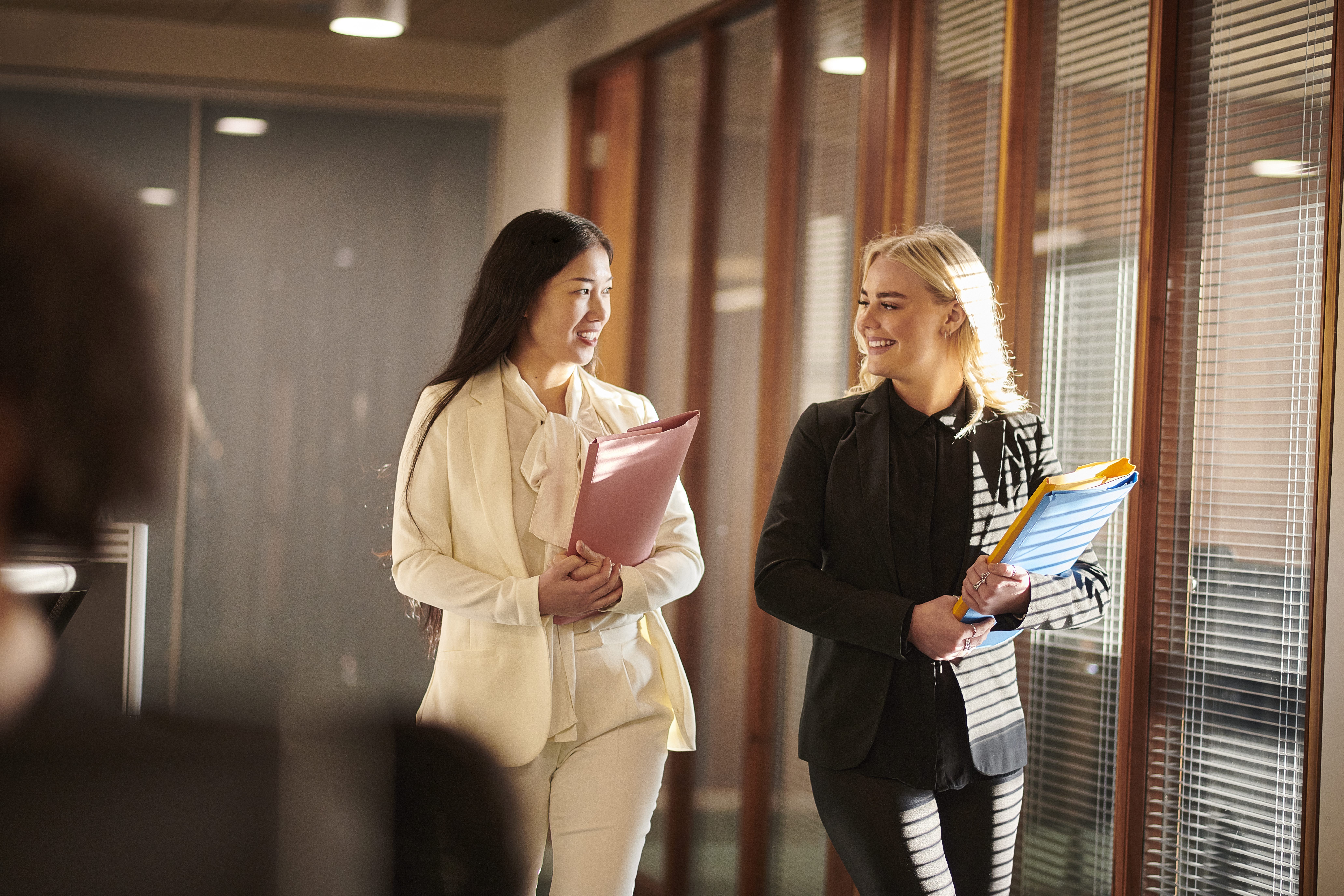 Colleagues walking the halls of an office 